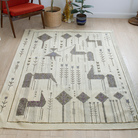Eva Nemeth vintage Scandinavian style tapestry displayed as a floor rug in a mid-century modern living room, showcasing its decorative impact.