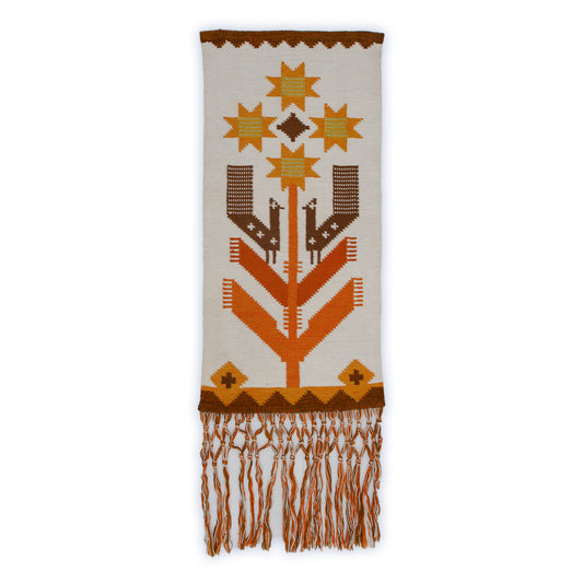 Vintage Eva Nemeth wool tapestry featuring a stylized Tree of Life with geometric birds and sun-stars. Handwoven vertical wall hanging in beige, brown, and burnt orange.