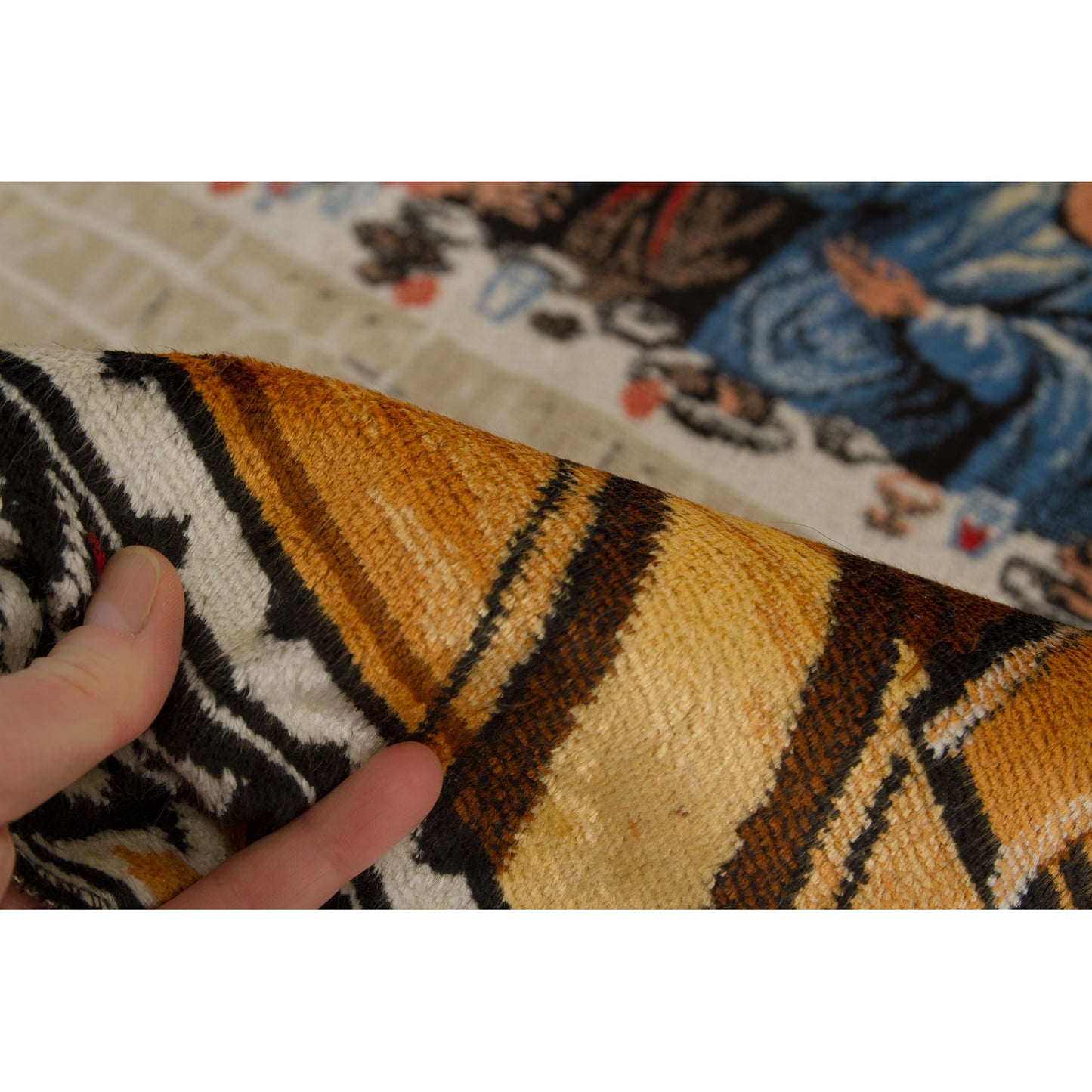 Hand supporting the bottom corner of the mid-century textile, showing how the brilliant golden yellow piles catch the light exactly like premium shiny velvet.