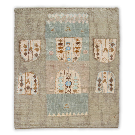 Full straight view of an extremely rare handknotted Eva Nemeth vintage tapestry isolated on a white background. The mid century wall art resembles a pastel drawing in muted blue, beige, and brown.