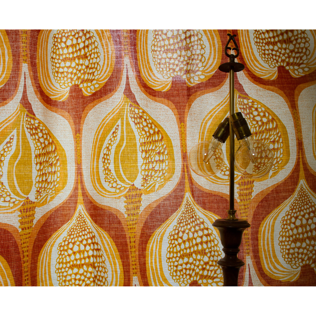 1970s style orange curtains behind a vintage floor lamp, warm retro interior