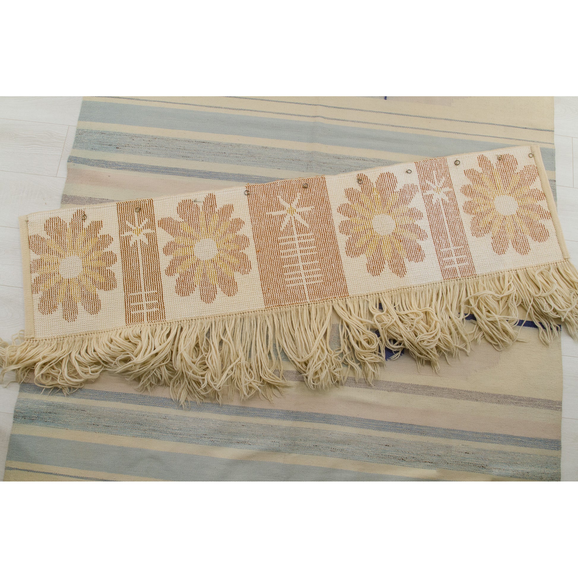 The tapestry laid reversed, flat on the floor, showing the clean cotton foundation and hand-knotting grid. Authentic handmade Hungarian quality from the 1970s.