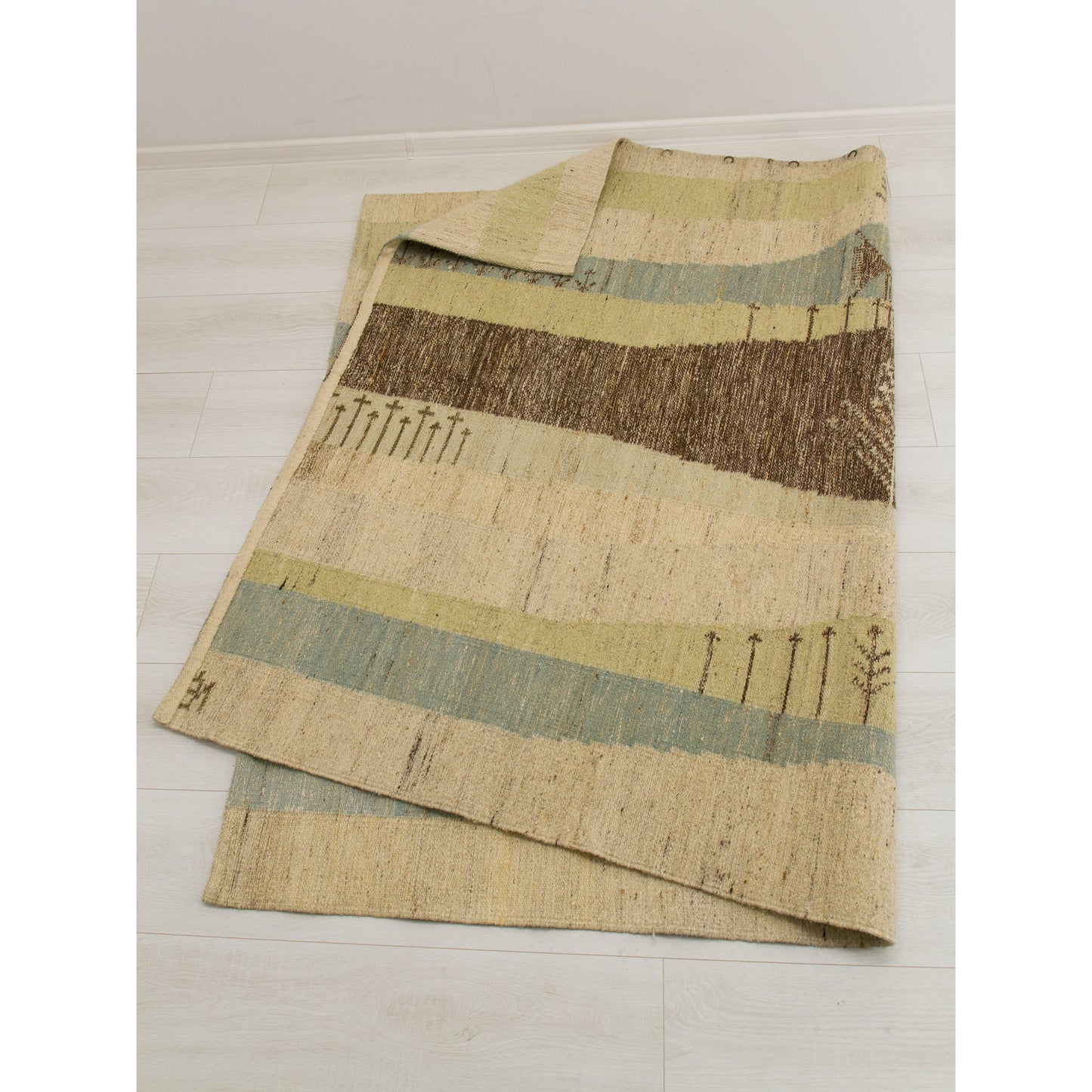 Thick, heavy-weight 9 lb flatweave wool tapestry folded back to reveal the impeccable craftsmanship and reversible weaving structure of genuine mid-century Hungarian textile art.