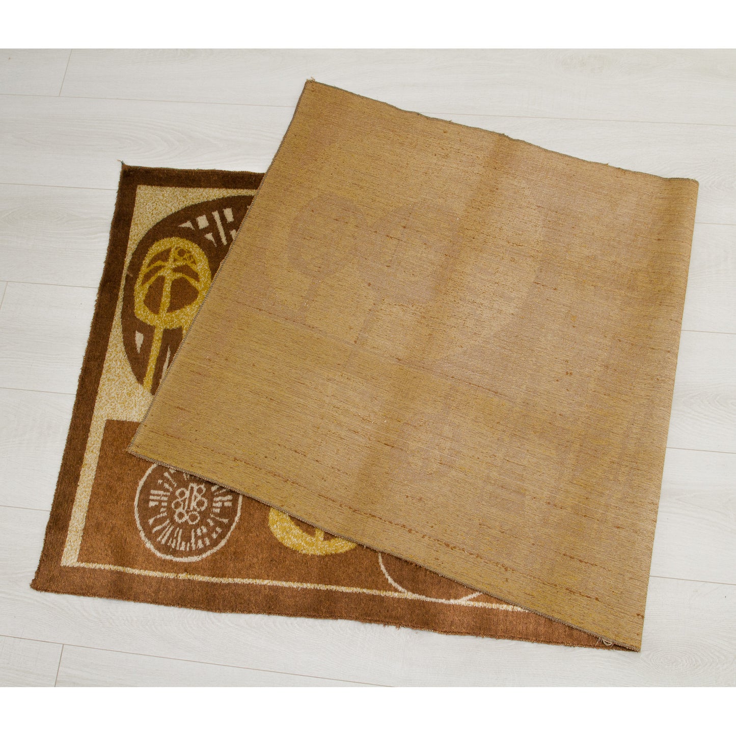 The tapestry folded over to reveal the smooth, beige woven backing contrasted with the thick, soft velvet-like pile on the front. Demonstrates the high-quality construction of vintage Hungarian industrial textile art.