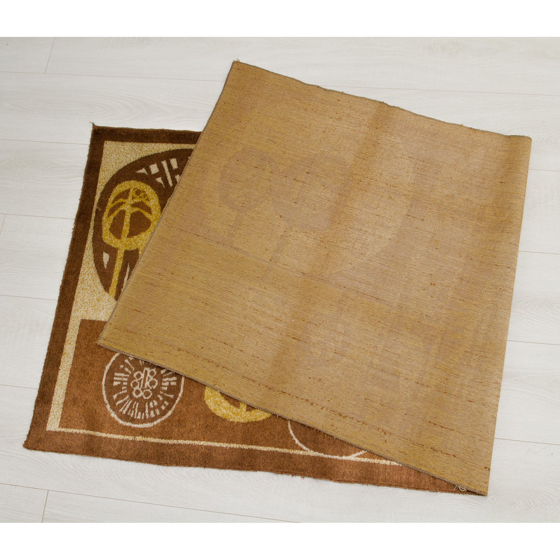 The tapestry folded over to reveal the smooth, beige woven backing contrasted with the thick, soft velvet-like pile on the front. Demonstrates the high-quality construction of vintage Hungarian industrial textile art.