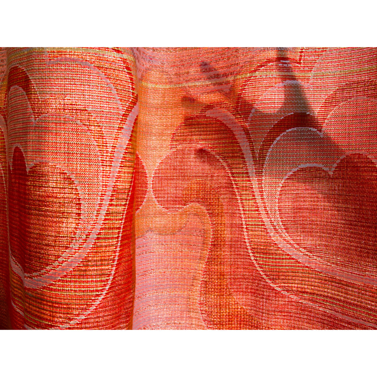 Hand shadow behind light-filtering vintage curtain, showing how some daylight comes through the woven fabric