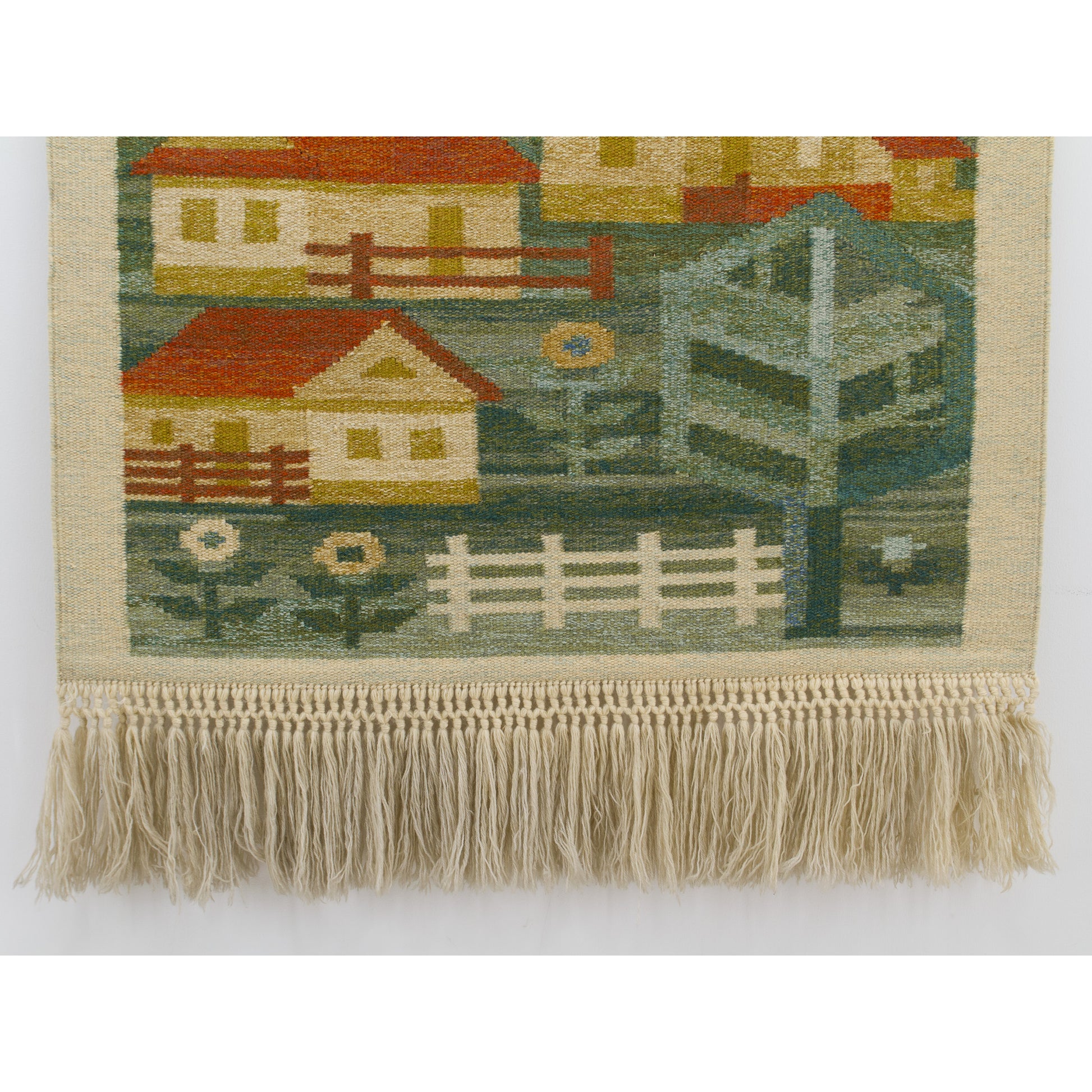 Detailed view capturing the lower village landscape blending into the meticulous, long hand-knotted beige and beige wool macrame fringes.