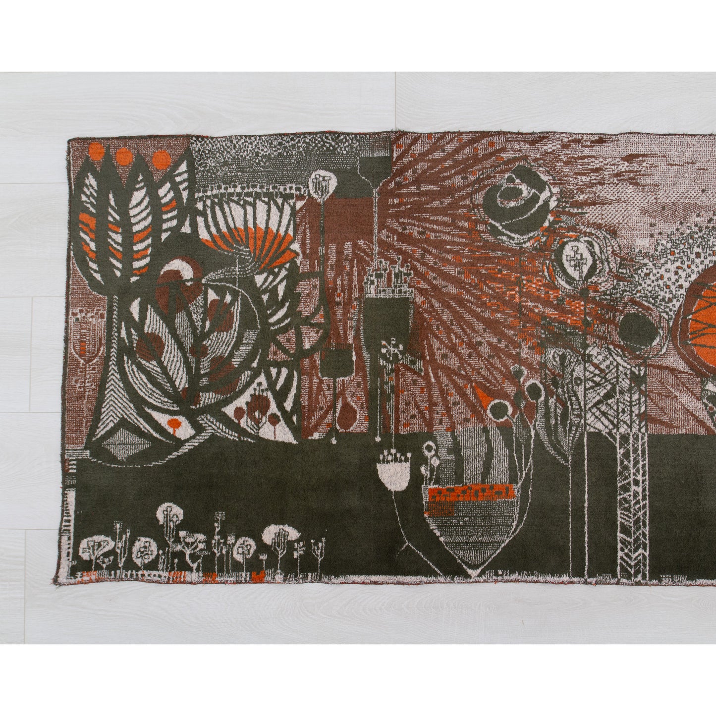 Detailed view of the left segment of the 1960s vintage wall hanging. Showcasing highly saturated orange organic motifs, dark brutalist silhouettes, and rich mid century aesthetic coloring.