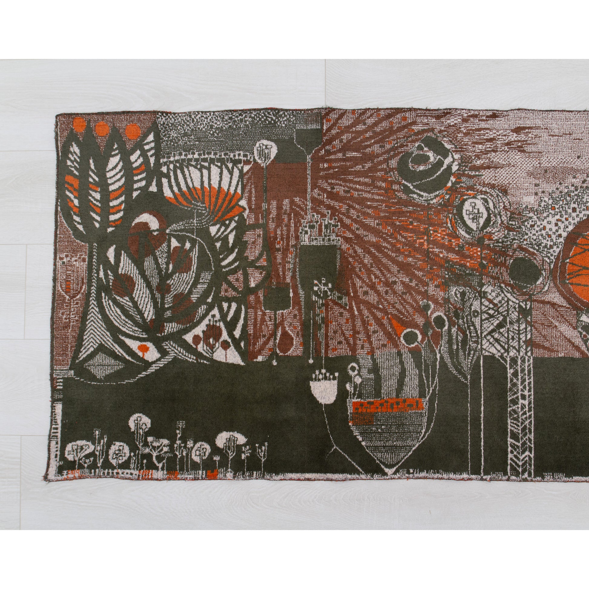 Detailed view of the left segment of the 1960s vintage wall hanging. Showcasing highly saturated orange organic motifs, dark brutalist silhouettes, and rich mid century aesthetic coloring.