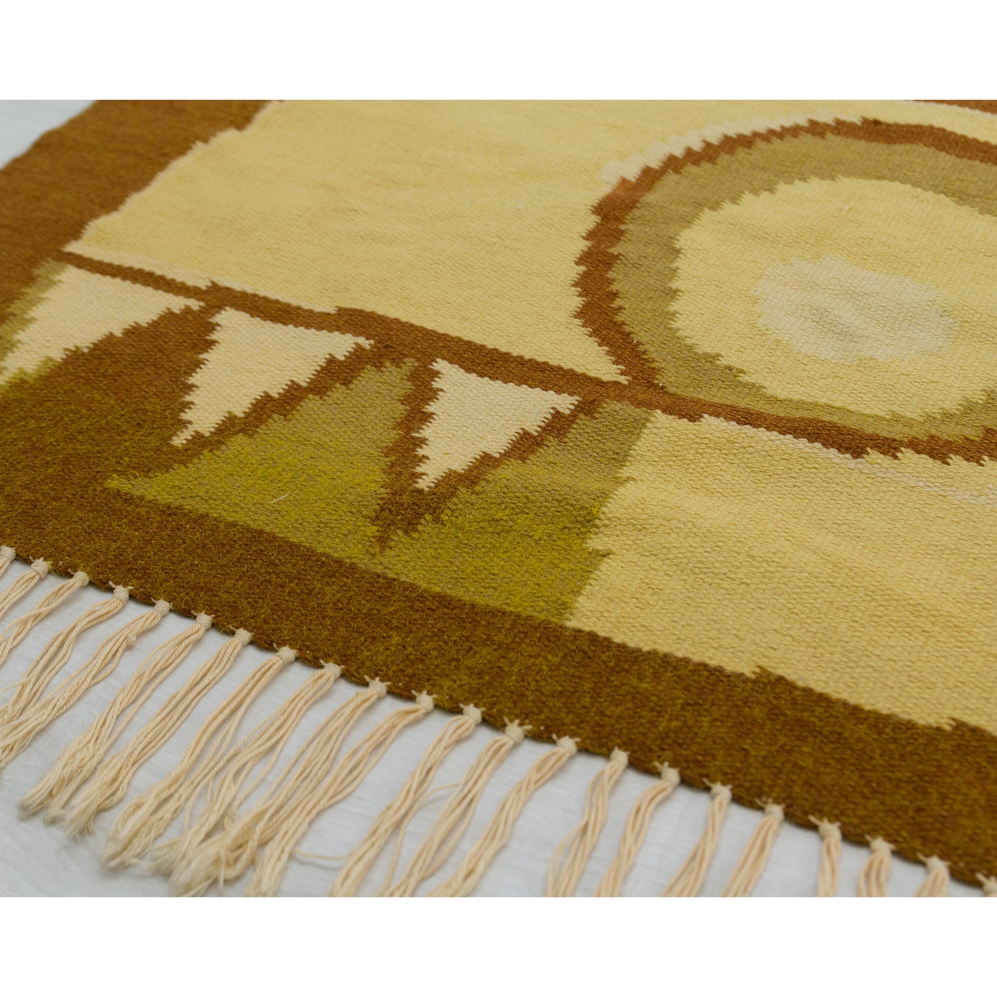 Angled perspective of the flatweave surface emphasizing the sharp, jagged triangular zig-zag design contrasting warmly against golden yellow backgrounds.