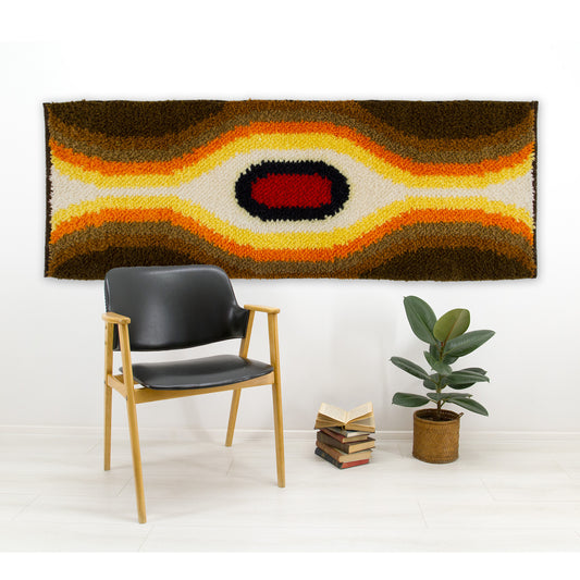 High-contrast vintage op-art style shag rug displayed horizontally as bold 1970s retro wall decor.