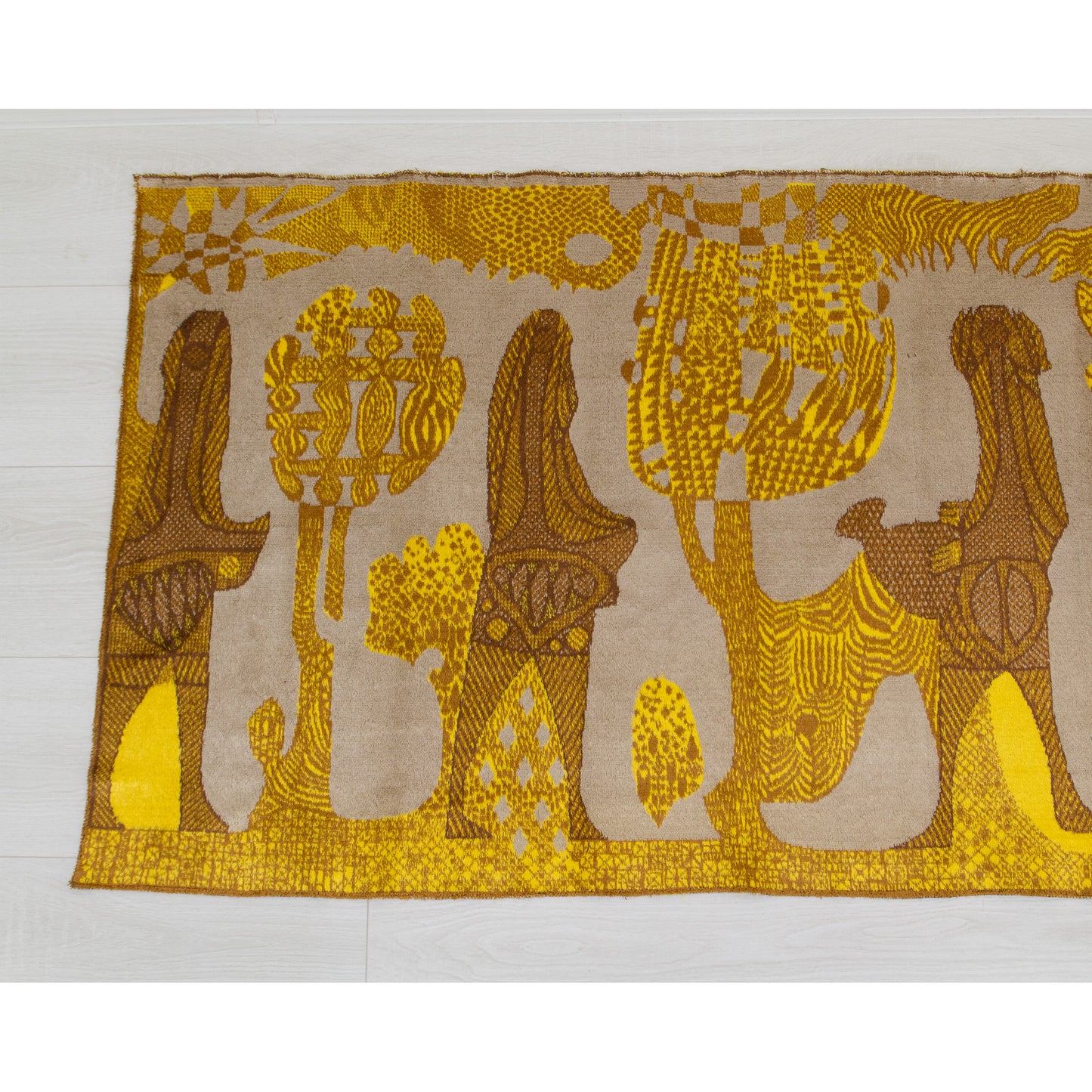 Left half of the vintage moquette tapestry featuring distinct elongated folk-art figures holding symbolic natural elements amongst stylized geometric mid century trees.