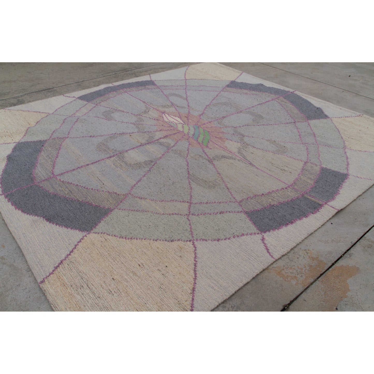 Top-down view highlighting the expansive 77x68 inch size of the vintage geometric area rug. Neutral cream, dove grey, and pink radiating patterns.