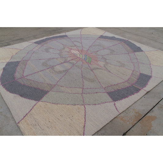 Top-down view highlighting the expansive 77x68 inch size of the vintage geometric area rug. Neutral cream, dove grey, and pink radiating patterns.