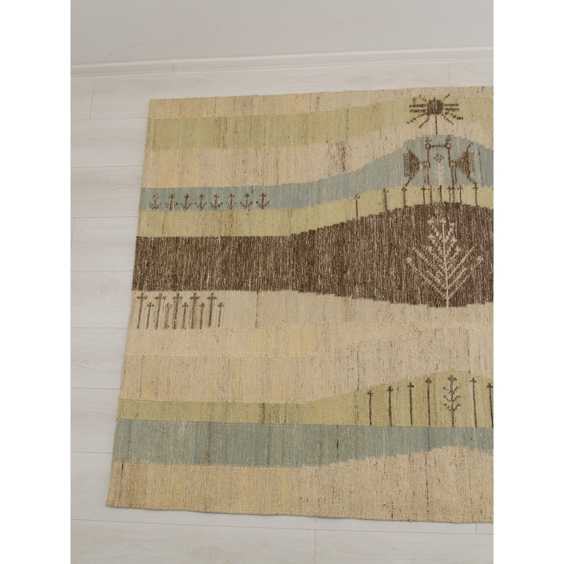 The left panel of the tapestry wall hanging featuring a serene abstract geometric landscape with stylized trees and calm pastel blue, muted green, and soft brown tones.
