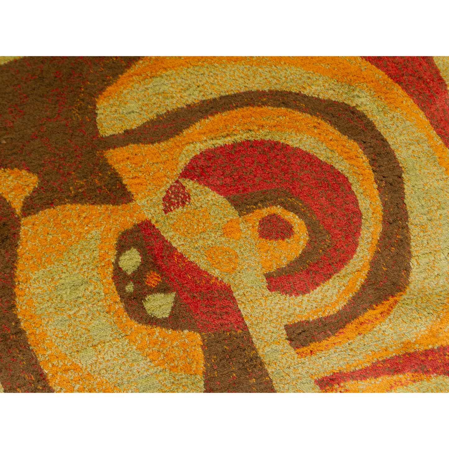 Extreme macro close-up of an abstracl swirling motif. Highlights the thick, soft pile of the moquette (velvet-like) fabric and the vibrant preservation of the 60s color dyes.