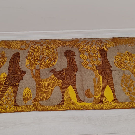 Video panning over the authentic 1960s tapestry, detailing the abstract mid-century design and warm color palette. Showing the soft fabric in hand gives an immediate sense of texture that ensures top vintage quality.