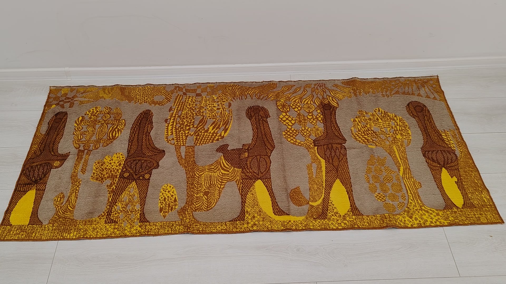 Video panning over the authentic 1960s tapestry, detailing the abstract mid-century design and warm color palette. Showing the soft fabric in hand gives an immediate sense of texture that ensures top vintage quality.