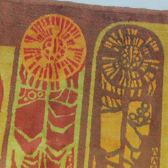 Video smoothly panning across the entirety of the earthy, glowing mid century tapestry and brushing across its thick, velvet-like fabric surface.