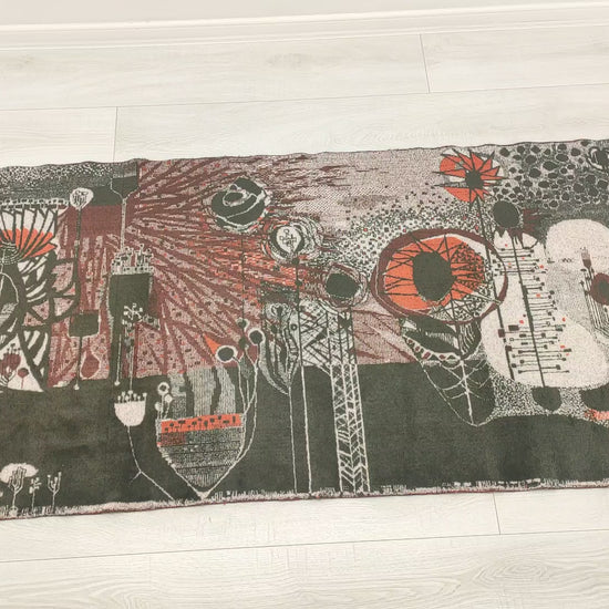 Video footage of an authentic 1960s mid century modern tapestry. A fascinating abstract, organic-brutalist design by award-winning Hungarian designer László Pécsi on a dark olive and grey background. Full view and macro shots demonstrating the outstanding mid-century design and high quality of this home decor staple.