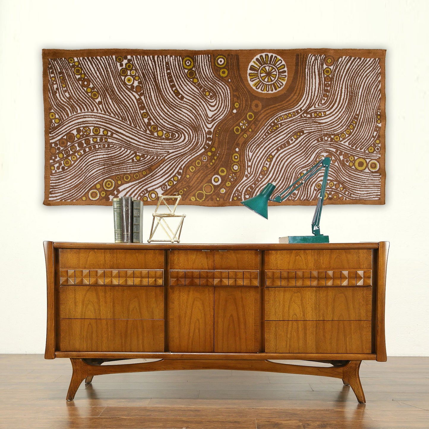 Massive vintage 1960s Emese tapestry styled perfectly over a wooden mid-century credenza. The abstract, psychedelic wavy design adds incredible warm earth-toned focal points to MCM decor.