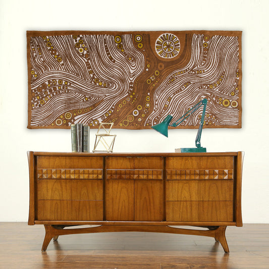 Massive vintage 1960s Emese tapestry styled perfectly over a wooden mid-century credenza. The abstract, psychedelic wavy design adds incredible warm earth-toned focal points to MCM decor.