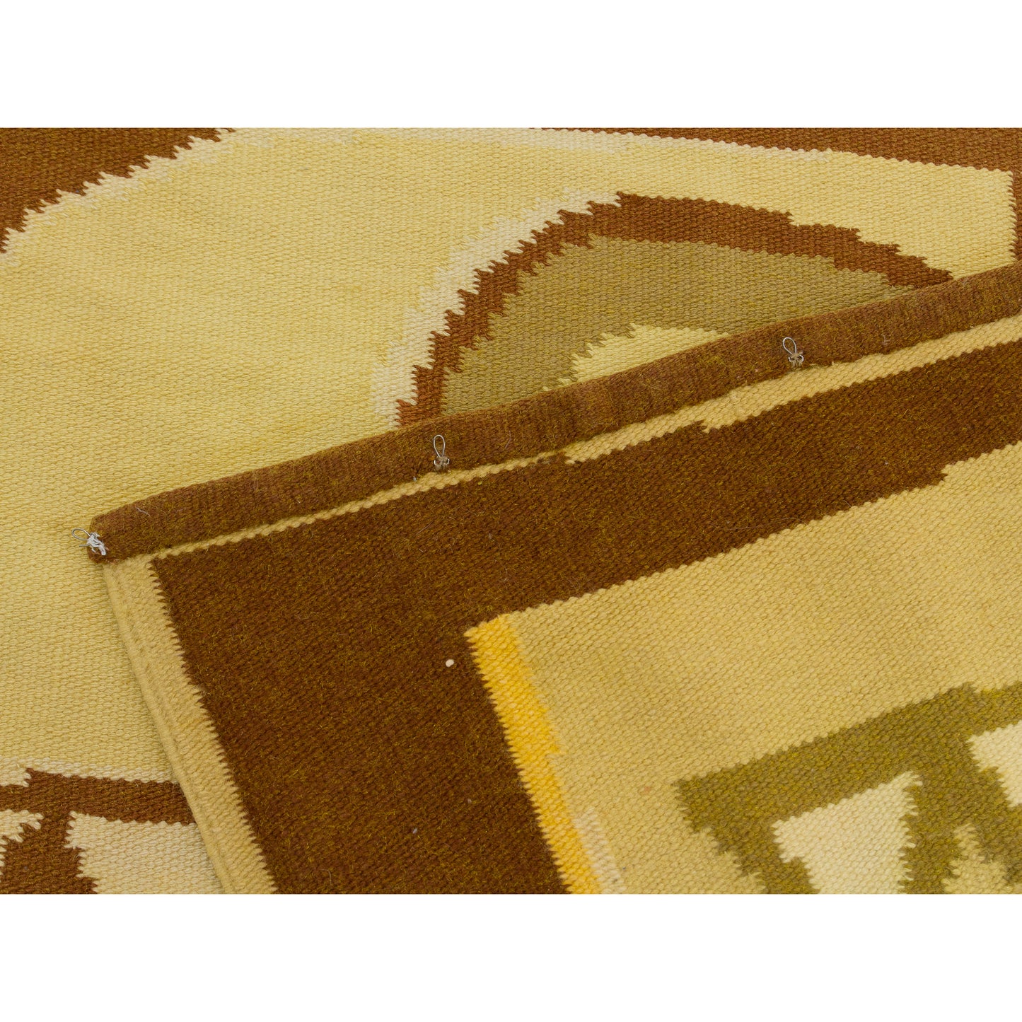 Detail exposing the top rear edge, highlighting multiple small metal attachment hooks carefully stitched onto the hem for quick, stress-free wall mounting.