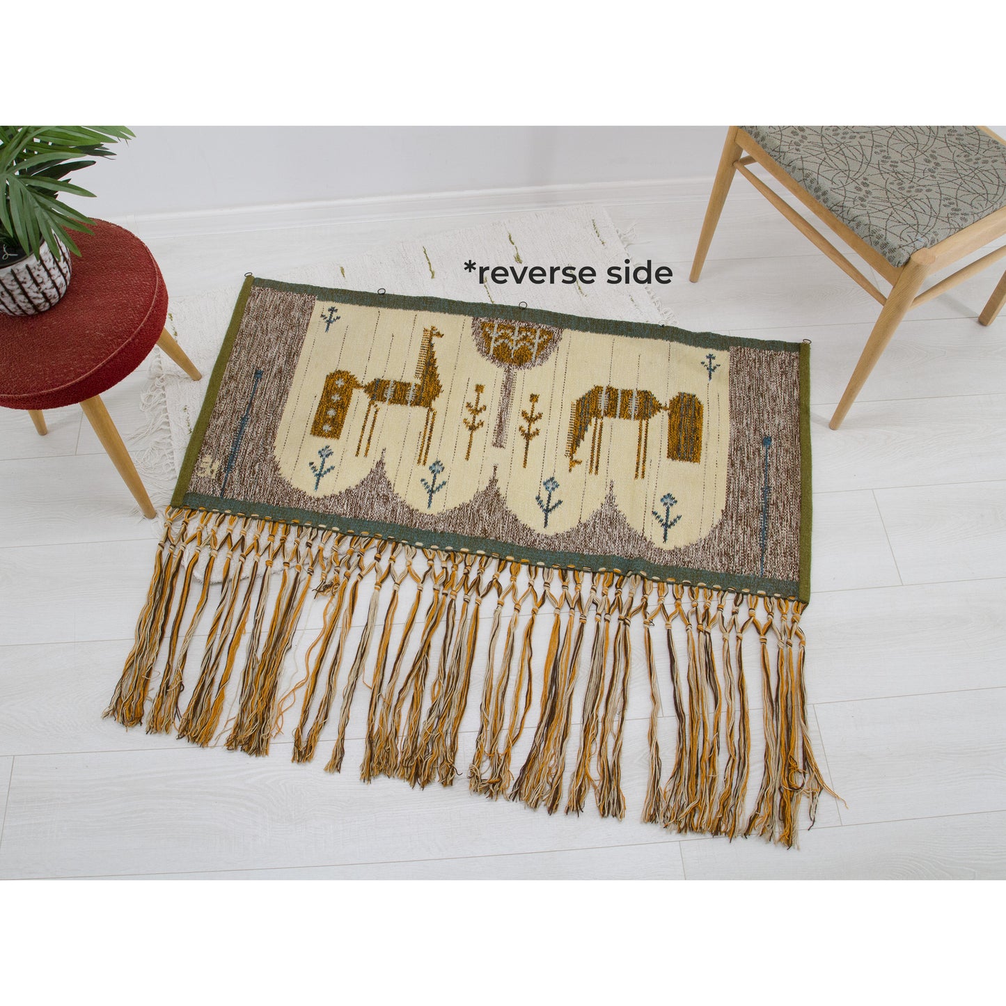 The tapestry is laid perfectly flat face down on the floor to expose the entire reverse side, assuring the buyer of its excellent, immaculately clean preservation.