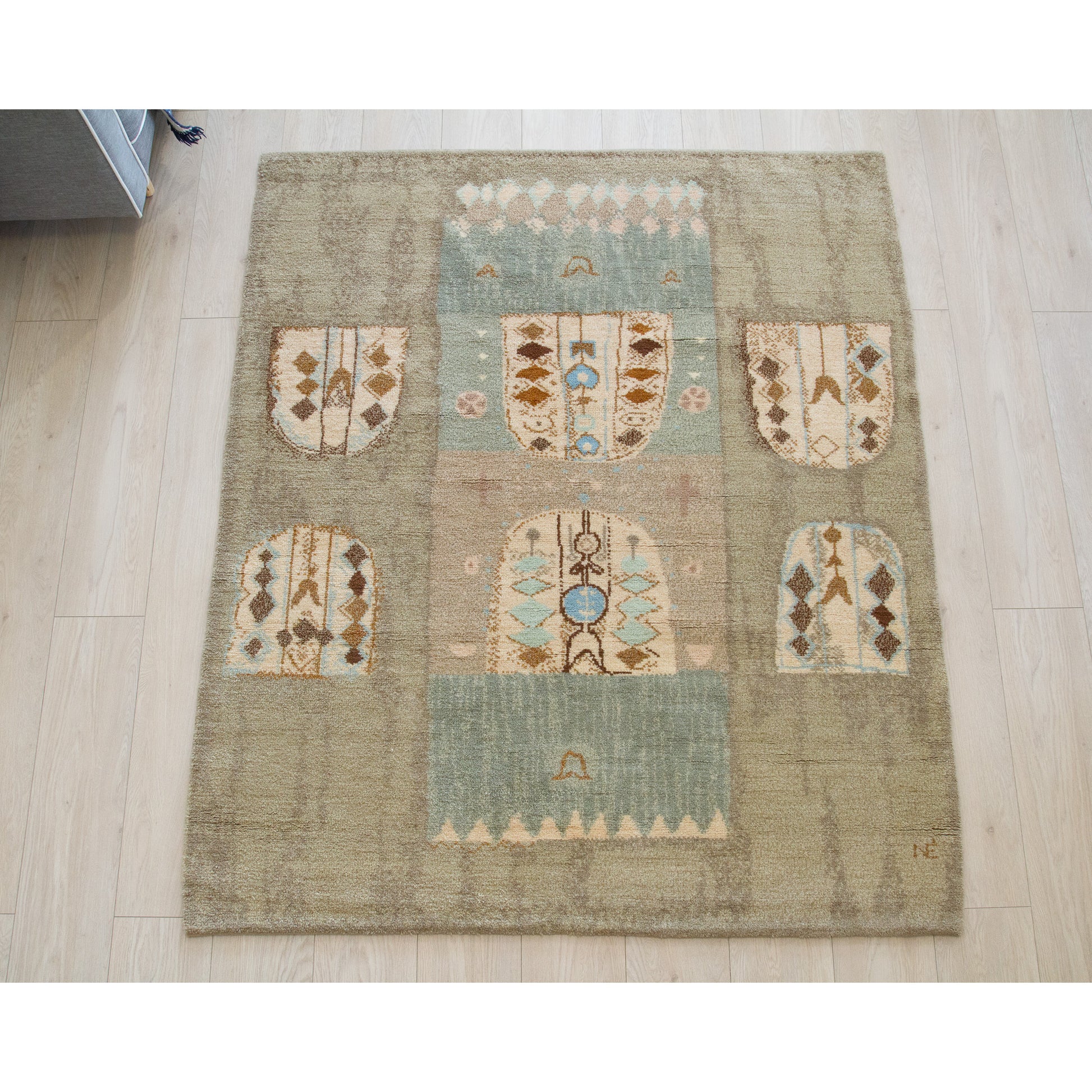 Large mid century tapestry laid flat on the floor. This 16-pound vintage handknotted rug demonstrates incredibly detailed European vintage craftsmanship, acting as a thick textile painting.