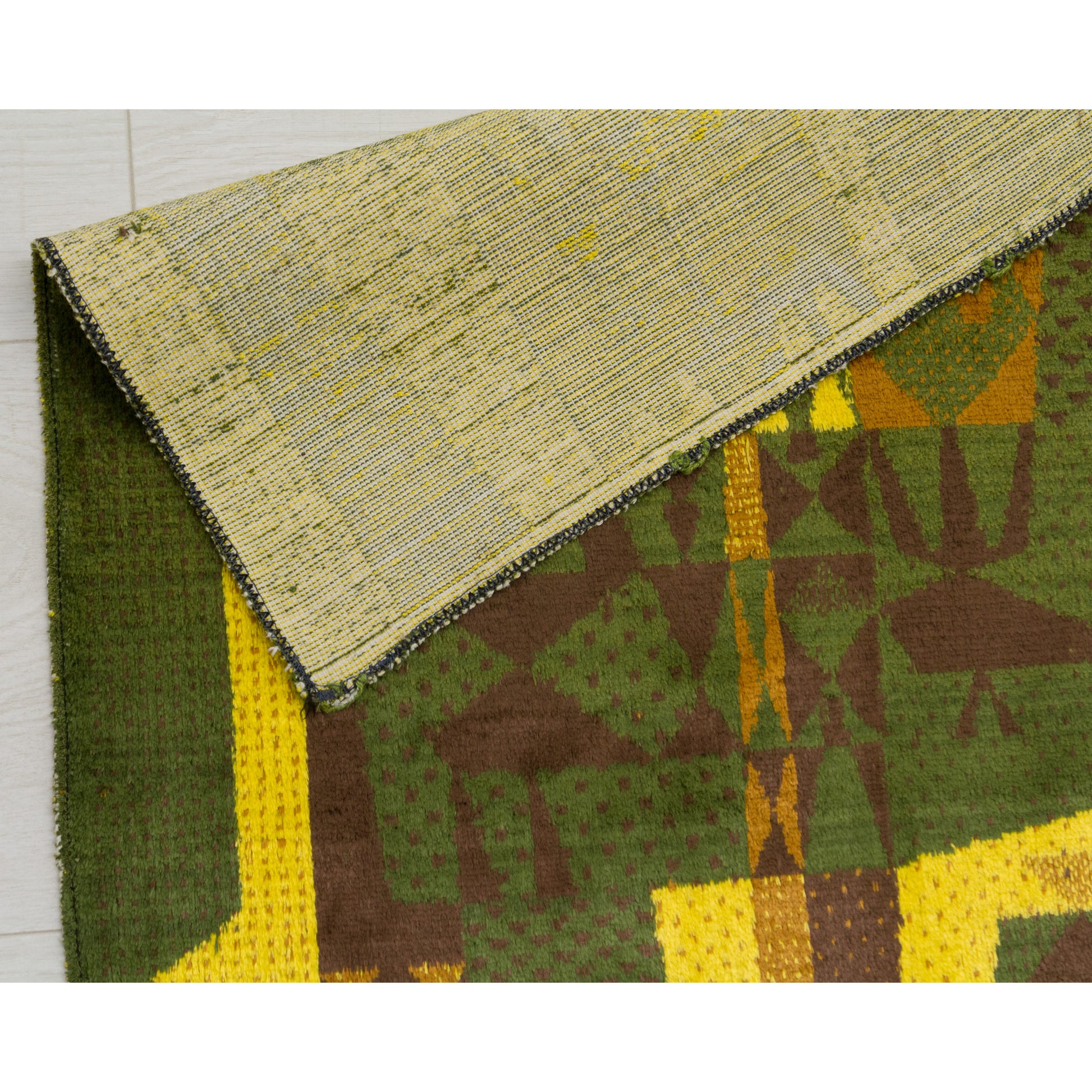 Macro detail of the vivid yellow velvet pile (moquette) and sturdy, woven backing. Soft, tactile textile art in mellow moss green with vivid, bright yellow accents for an energizing, jazzy feel.