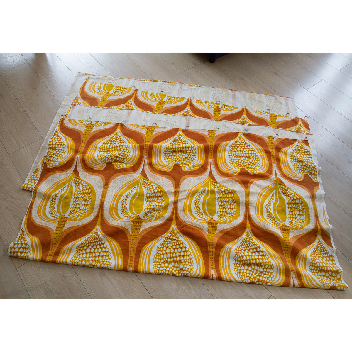 Retro orange and yellow vintage fabric panel laid flat, great for sewing projects