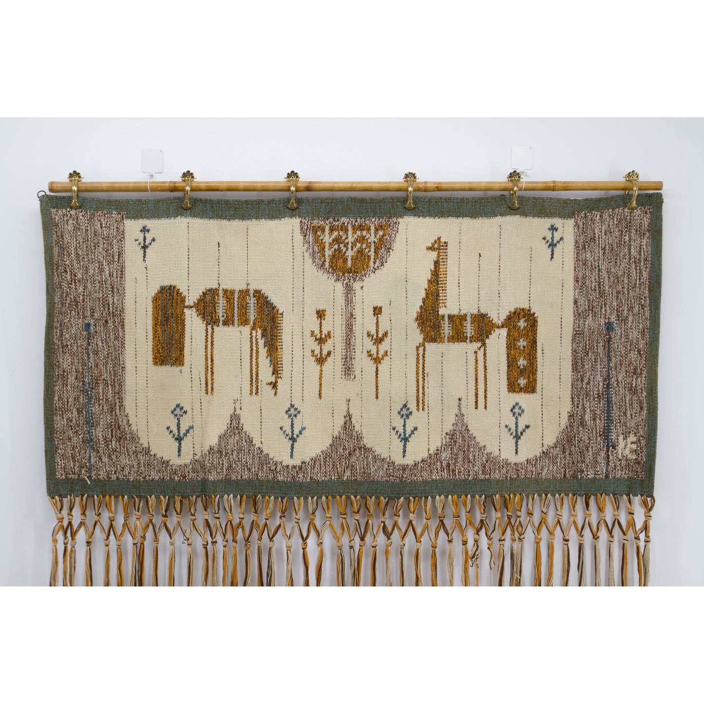 Detailed straight view isolating the handwoven top part of the textile, focusing purely on the beautifully stylized folklore horses and central Tree of Life design.