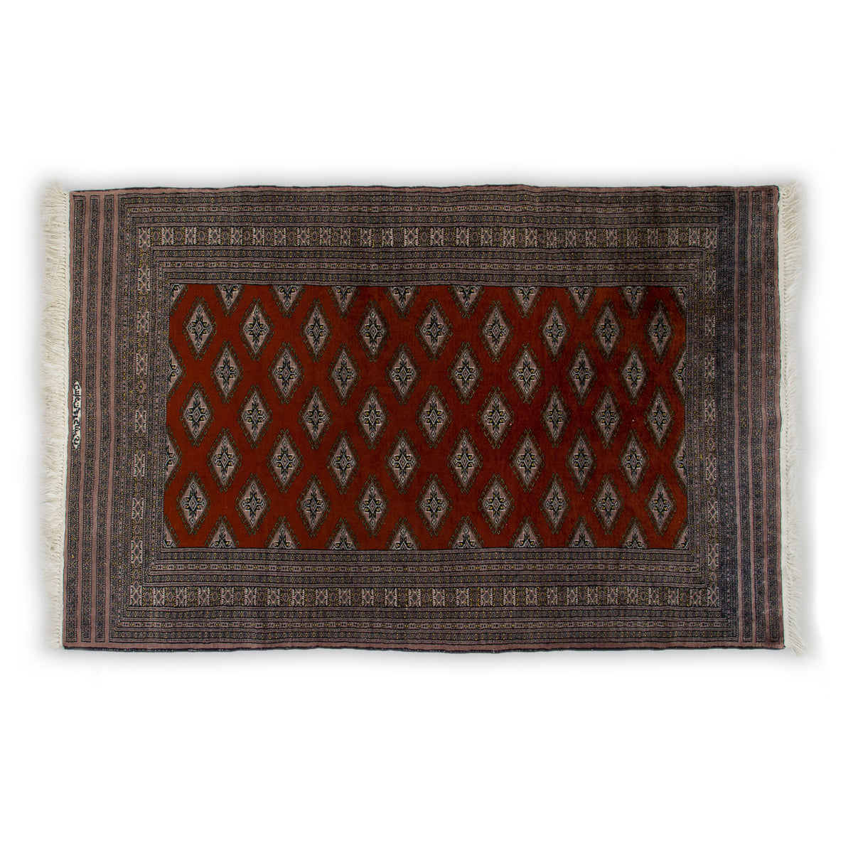 Top view of a vintage hand-knotted silk Bokhara rug with rust red Turkoman gul pattern, mauve borders and cream fringe. The vintage rug is in excellent condition.