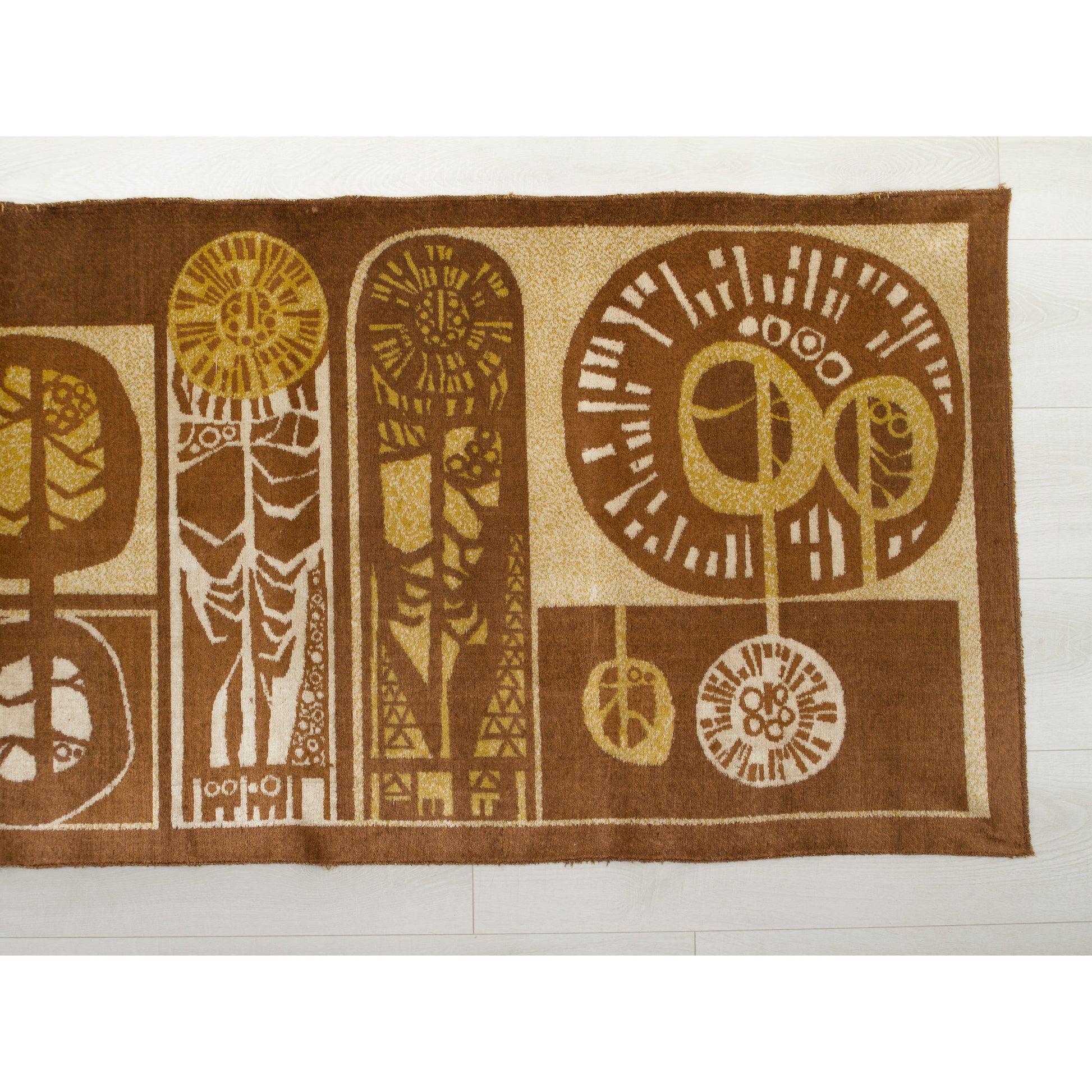 Close-up of the tapestry's right section showing round shapes resembling of trees and two sleek, vertical shapes that reminds of oversized flowers. Rich chocolate brown background with warm caramel and beige woven accents. Authentic 1960s graphic design.