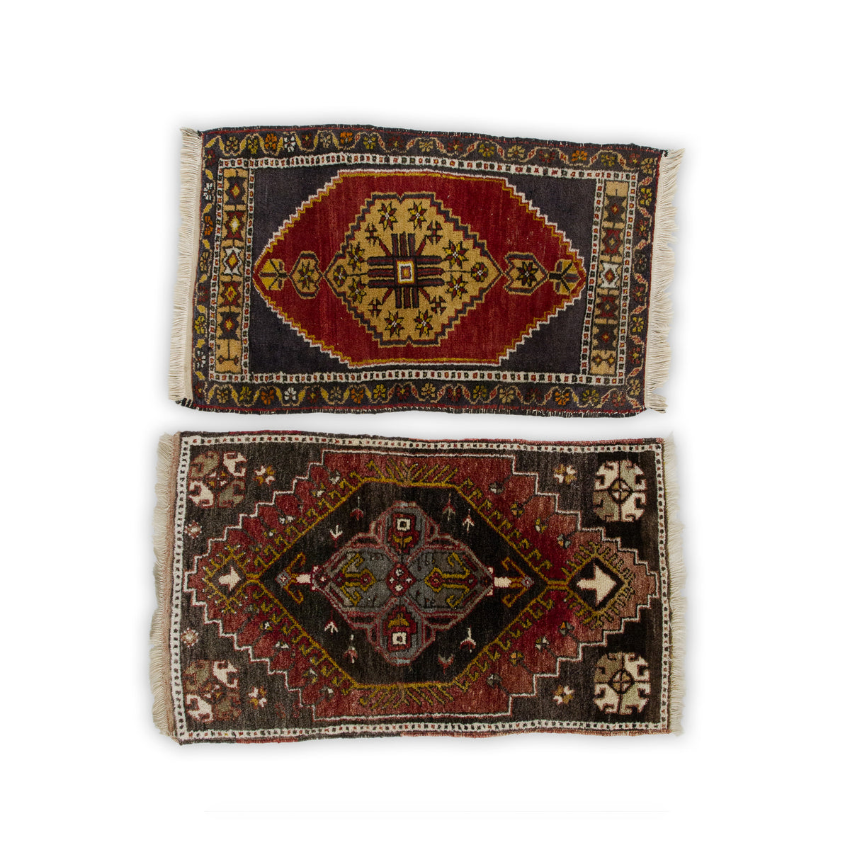 Set of two small vintage Turkish yastik rugs, one red with a gold medallion and one dark brown, shown from above