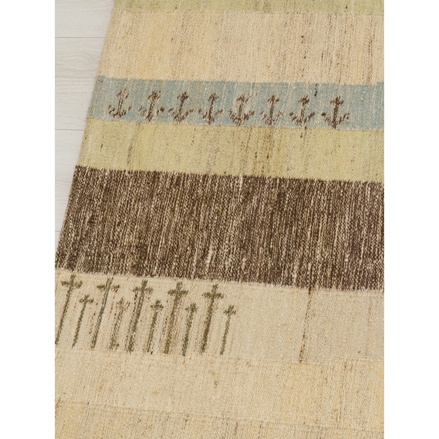 Detail of the stylized forest and tree silhouettes. The earthy, muted beige and brown pastel colors create an instant calming, organic modern aesthetic.