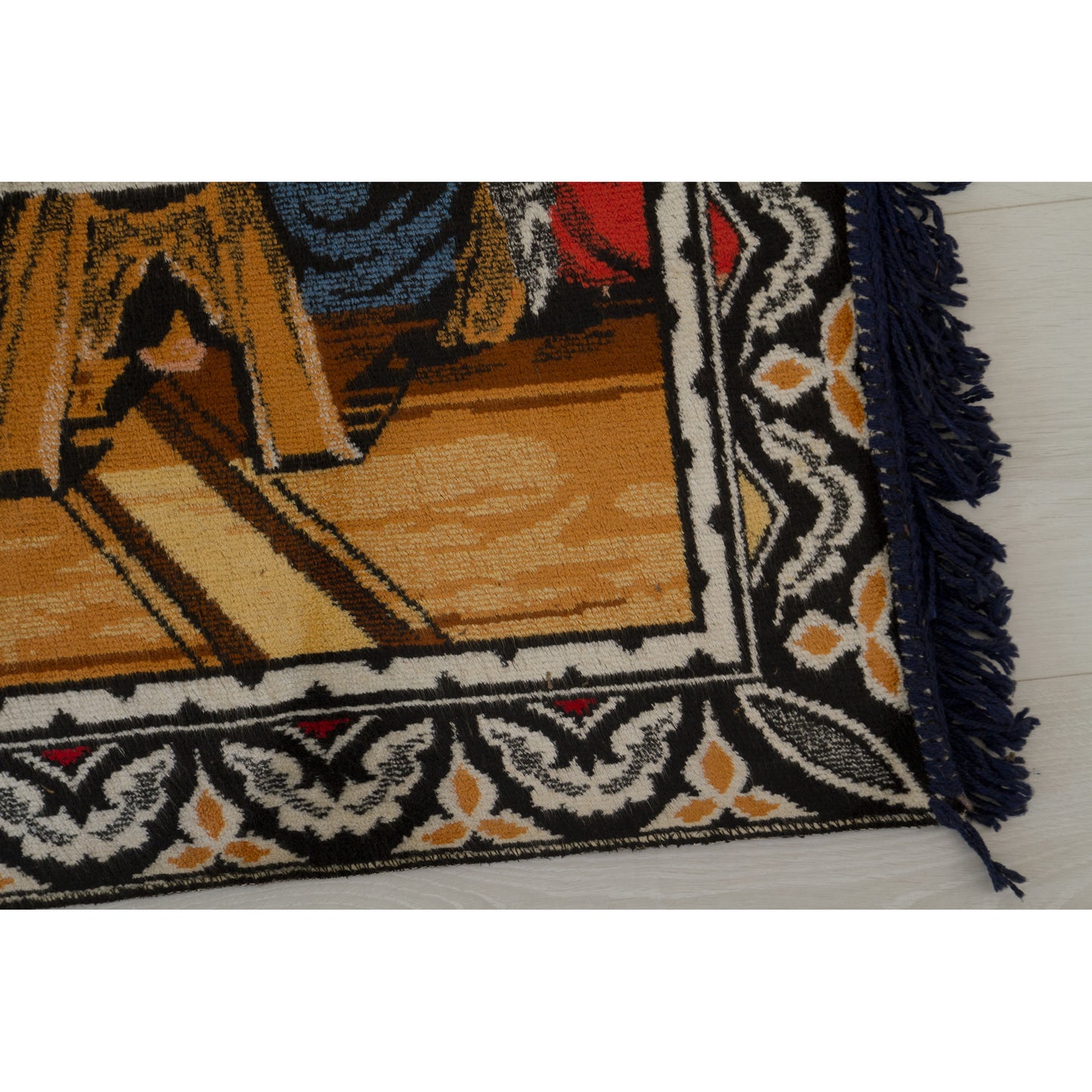 Macro focus on the beautifully detailed dark blue, beige, and red scrolling border pattern that beautifully frames the large 1960s vintage mural.