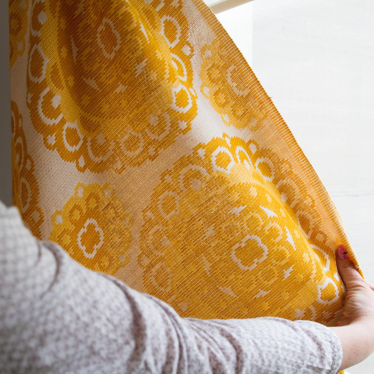 Edge detail of 70s yellow vintage woven curtain panel, neatly finished seam