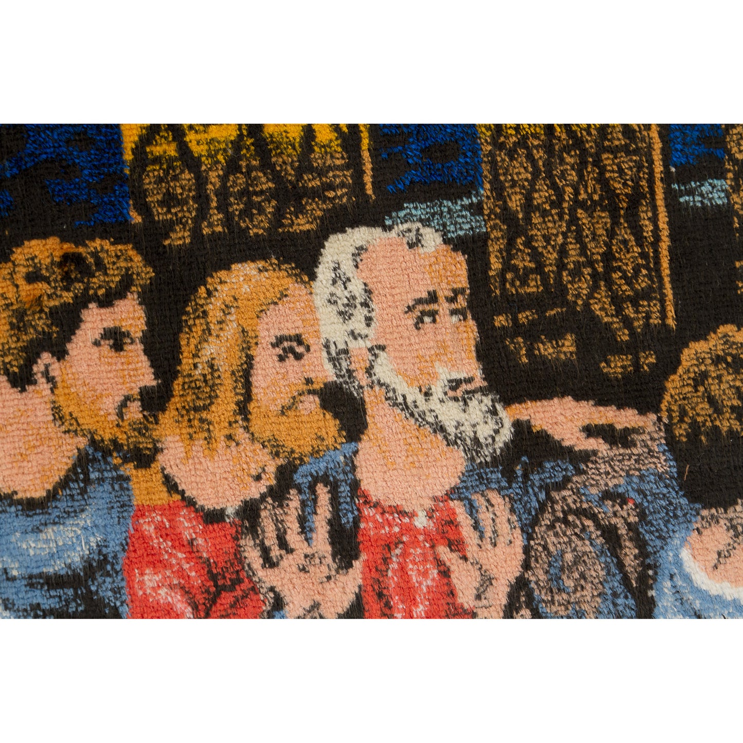 Extreme close-up of the tapestry material showcasing how beautifully the colorful velvet-like piles depict the detailed, emotional faces of the historic biblical men.
